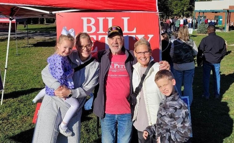 Bill welcomes early voters to his tent on the first day of early voting.